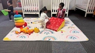 Young children playing together in the classroom